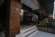 Close-up of a modular unit's entrance featuring a stylish door and planter boxes.