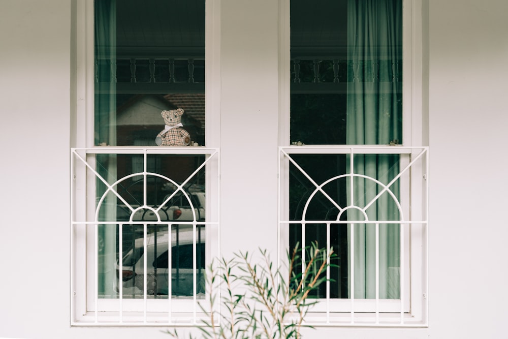 white wooden framed glass window