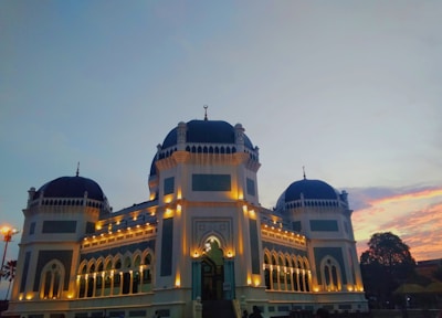 A beautifully restored Islamic architectural site in Saudi Arabia at sunset.
