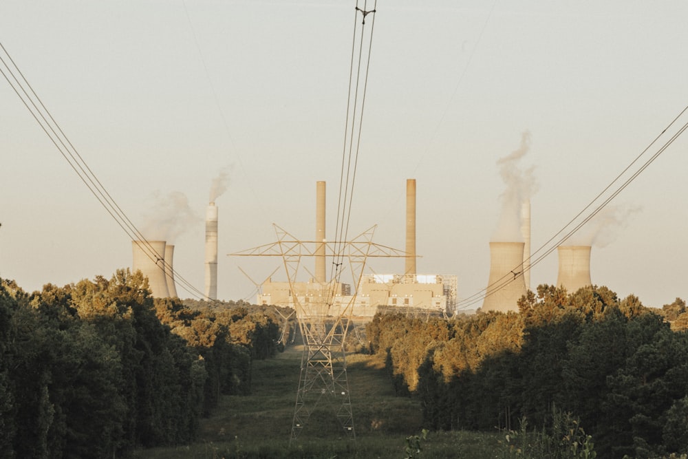 white factory under white sky during daytime