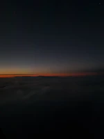 Soft glow of sunset merging with shadows, embodying quiet cosmic energy.