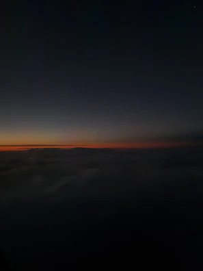 Soft glow of sunset merging with shadows, embodying quiet cosmic energy.