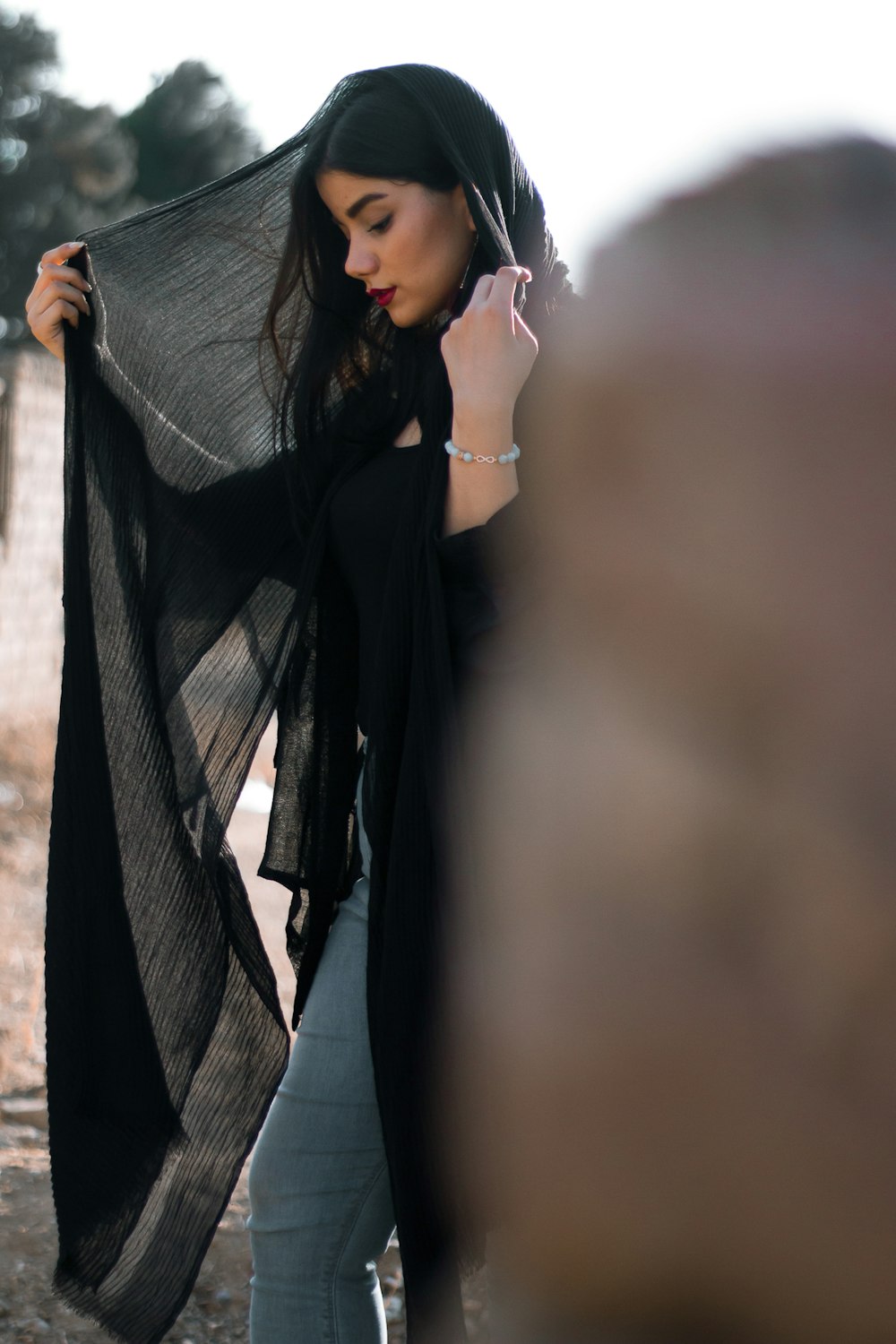 woman in black and gray scarf