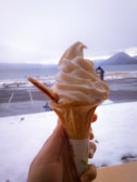 A serene view of Nordic fjords with ice cream cones in the foreground.