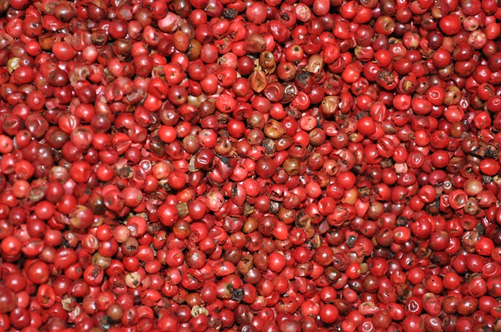 red round fruits on brown wooden table