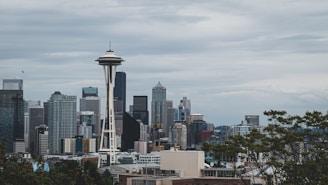 city skyline under white clouds during daytime