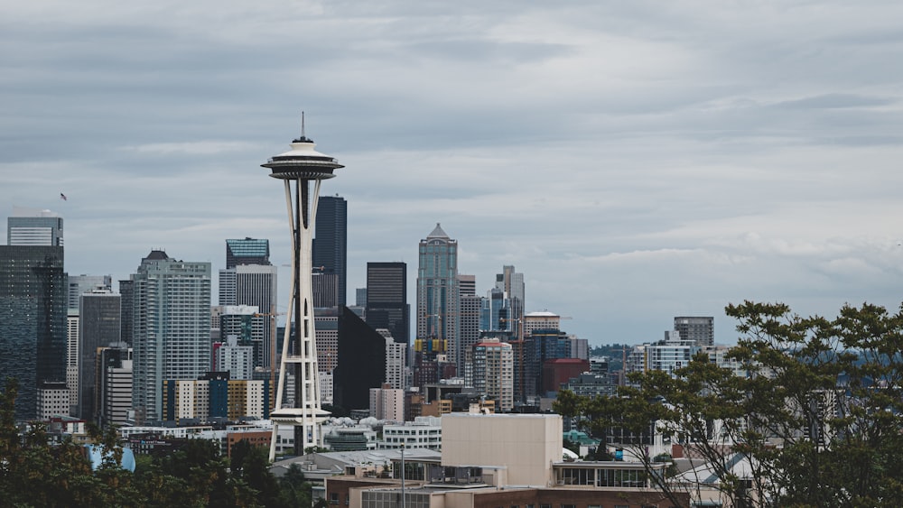 city skyline under white clouds during daytime