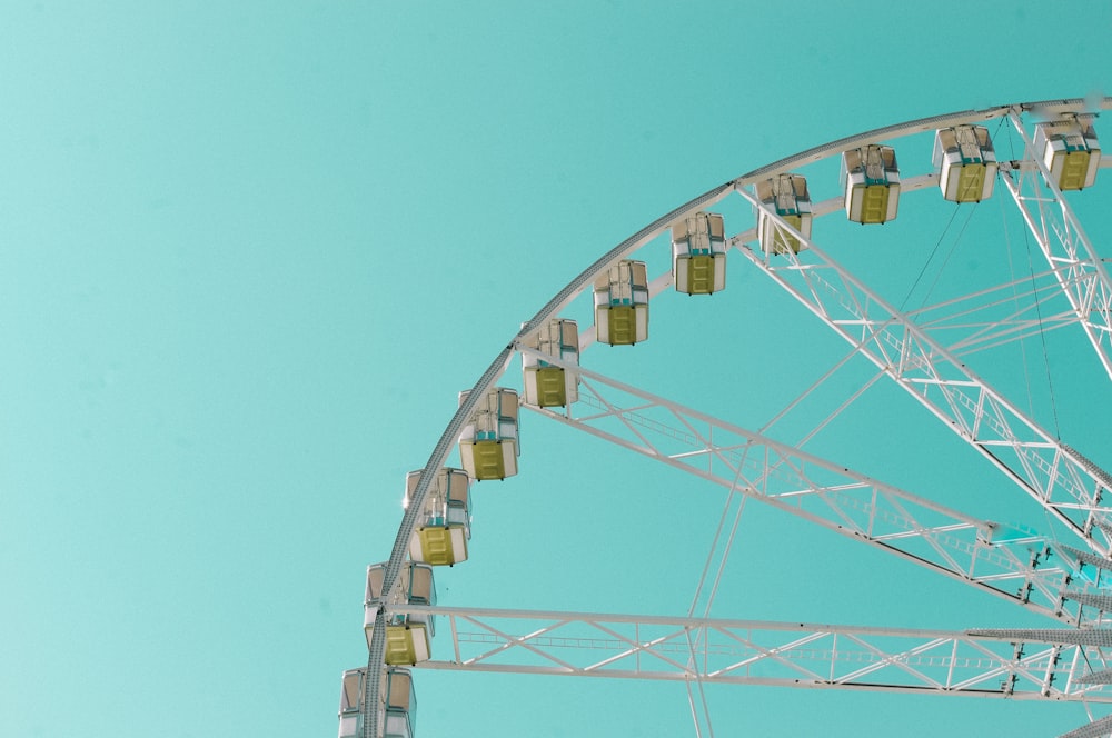 white ferris wheel under blue sky during daytime