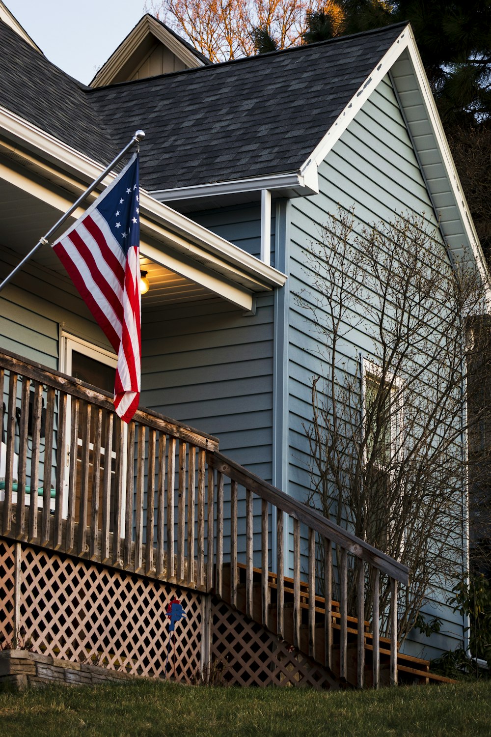 us a flag on brown wooden fence