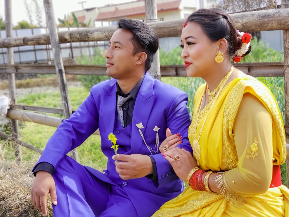 a man and a woman sitting next to each other