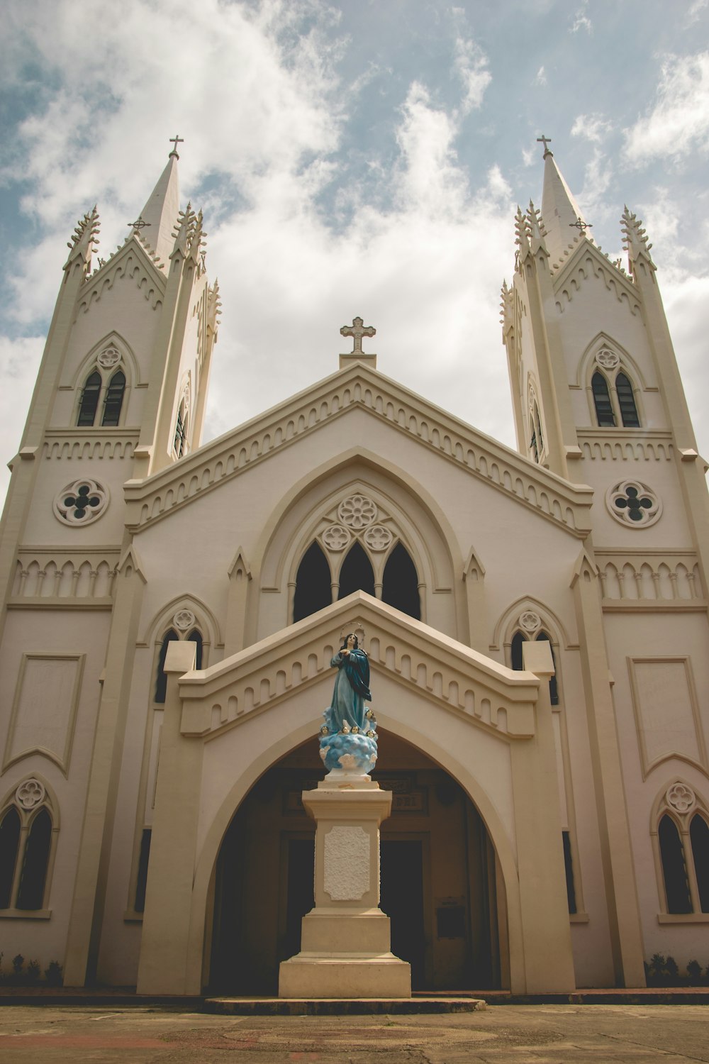 white and brown concrete church under blue sky during daytime