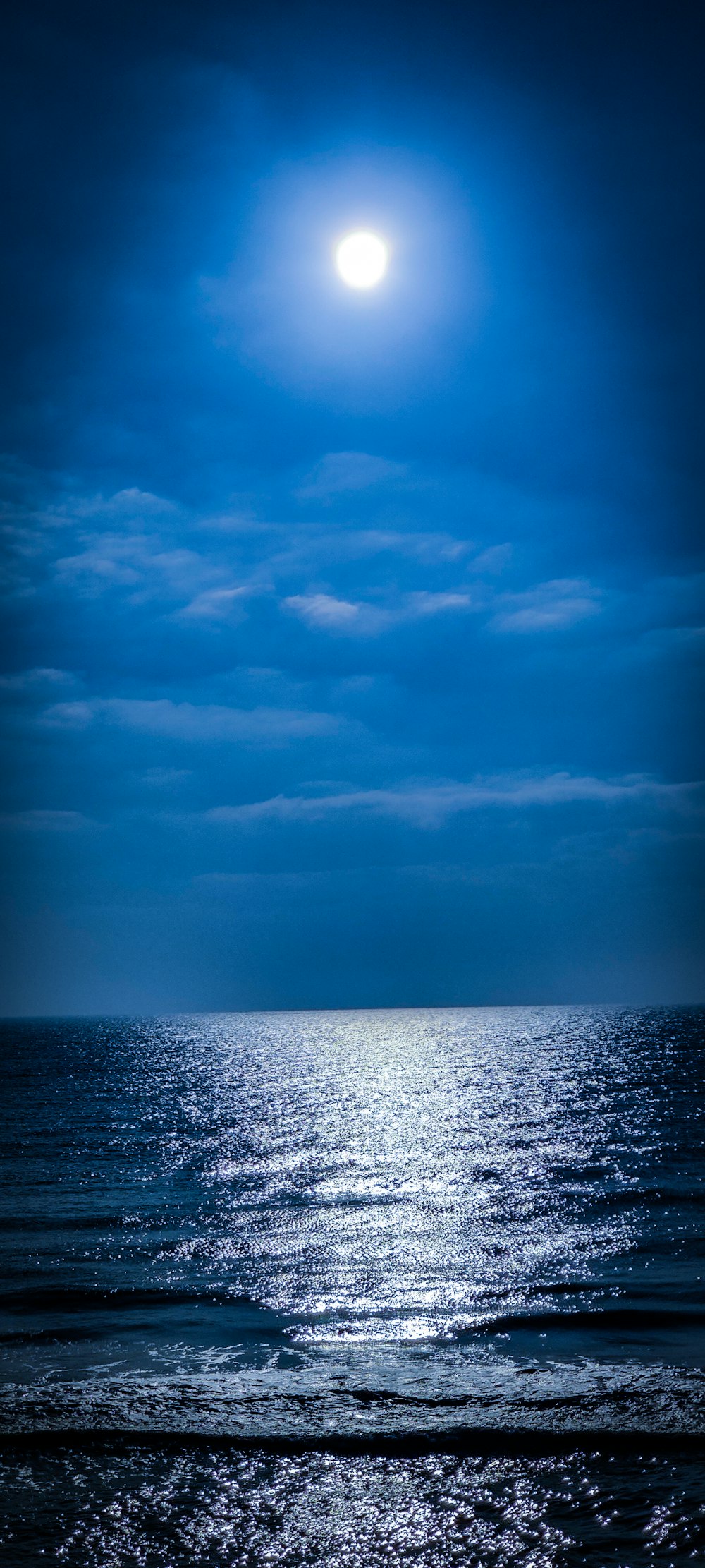 body of water under cloudy sky during daytime