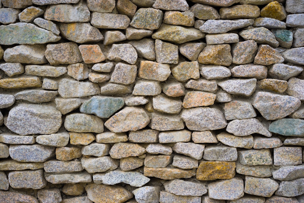 a stone wall made up of rocks and gravel