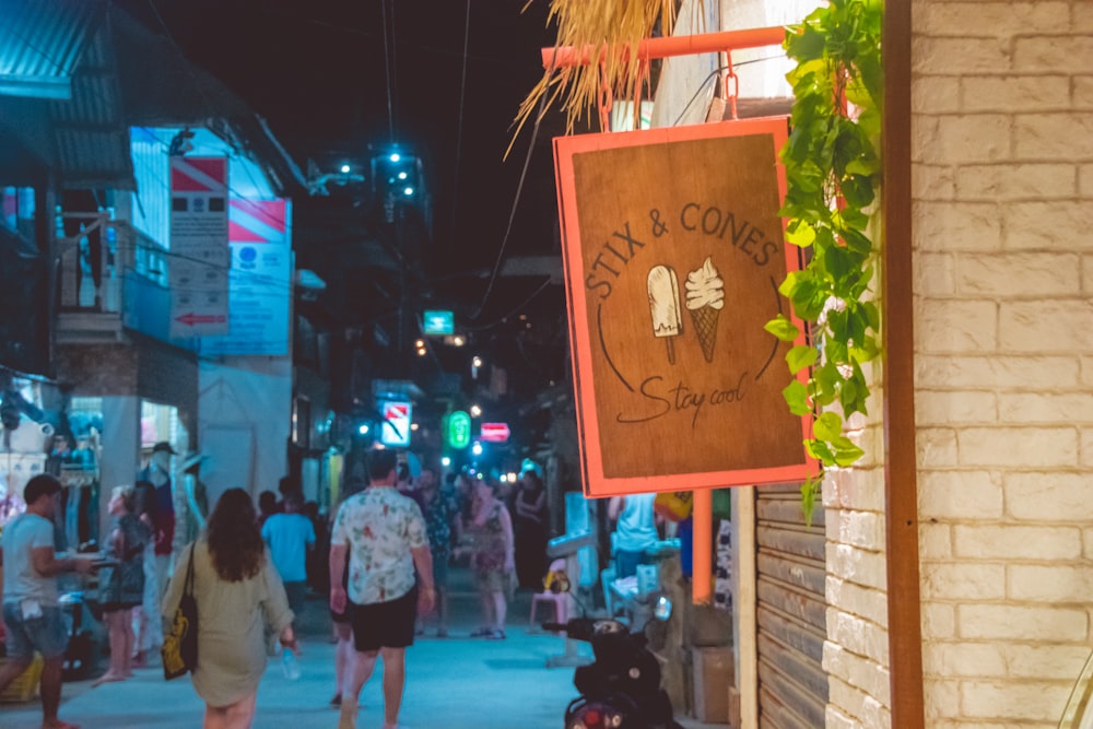 people walking on street during nighttime