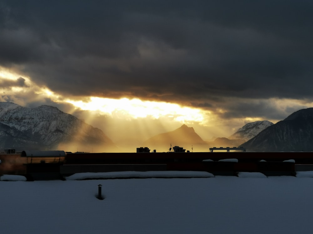 white clouds over mountains during daytime