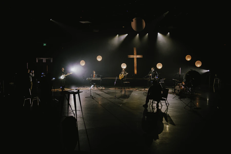 A musician leading worship on stage