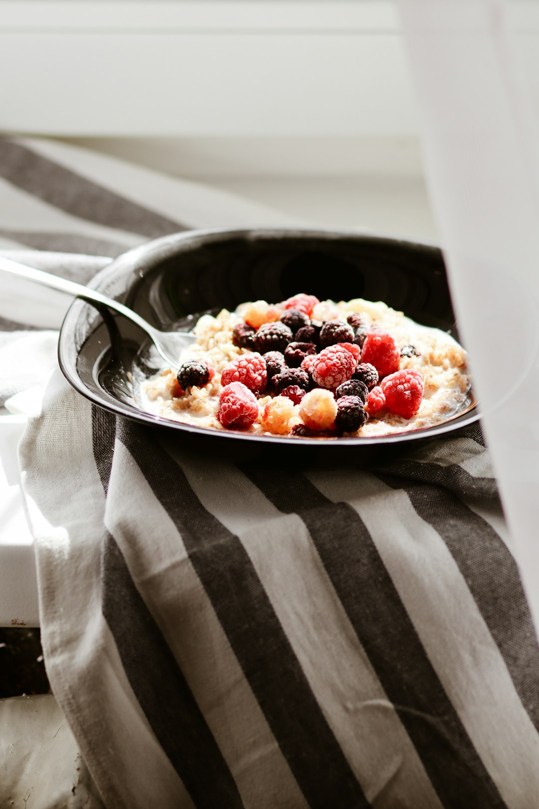 stainless steel spoon on white ceramic plate