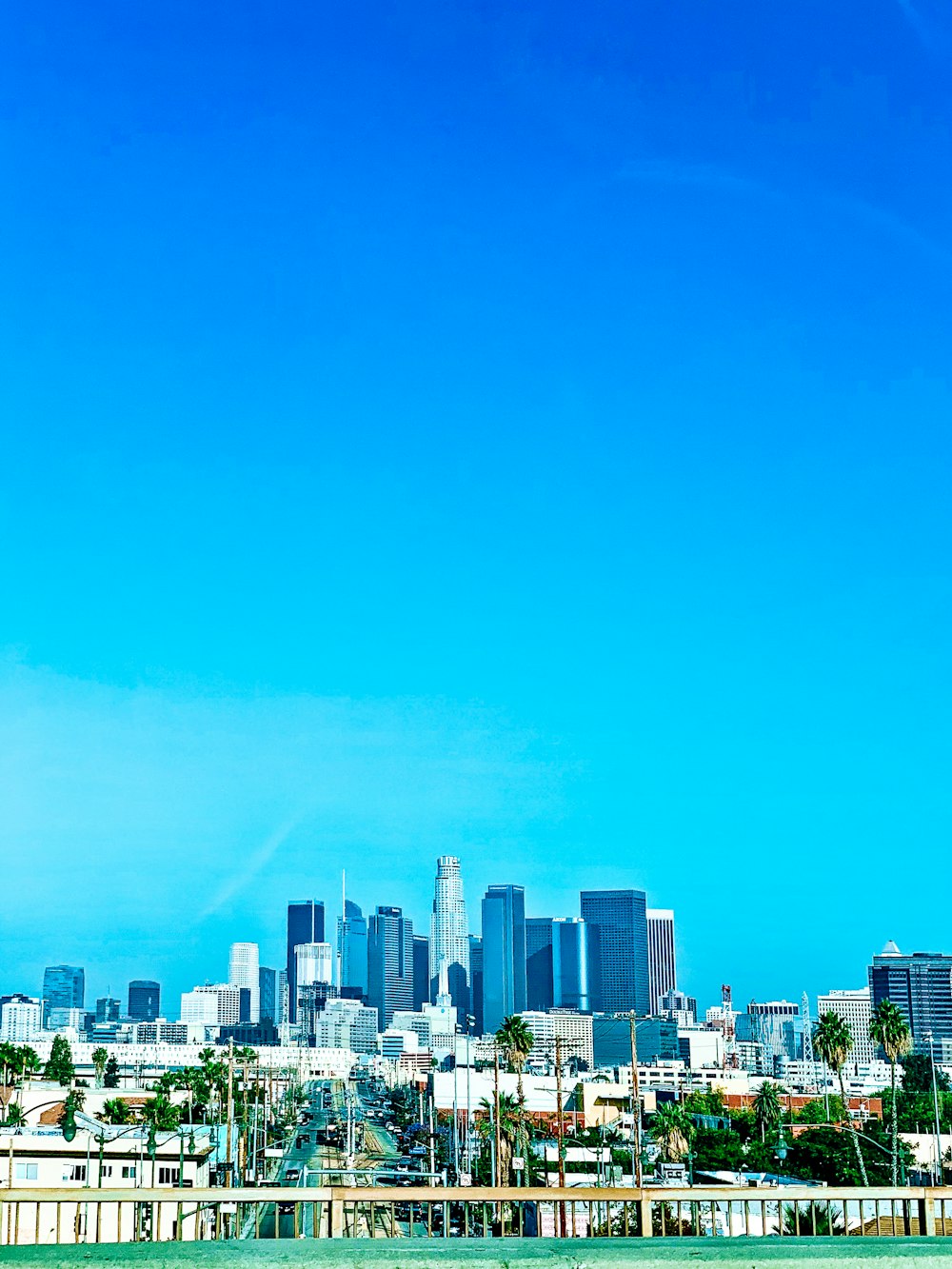 city skyline under blue sky during daytime