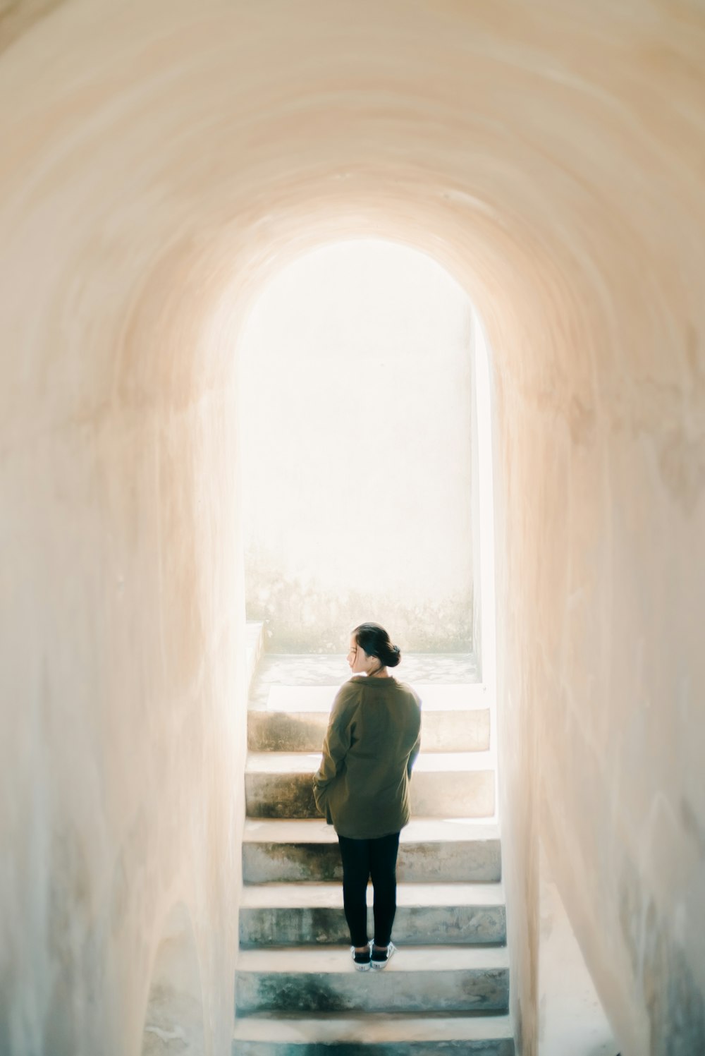 a person standing on a set of stairs