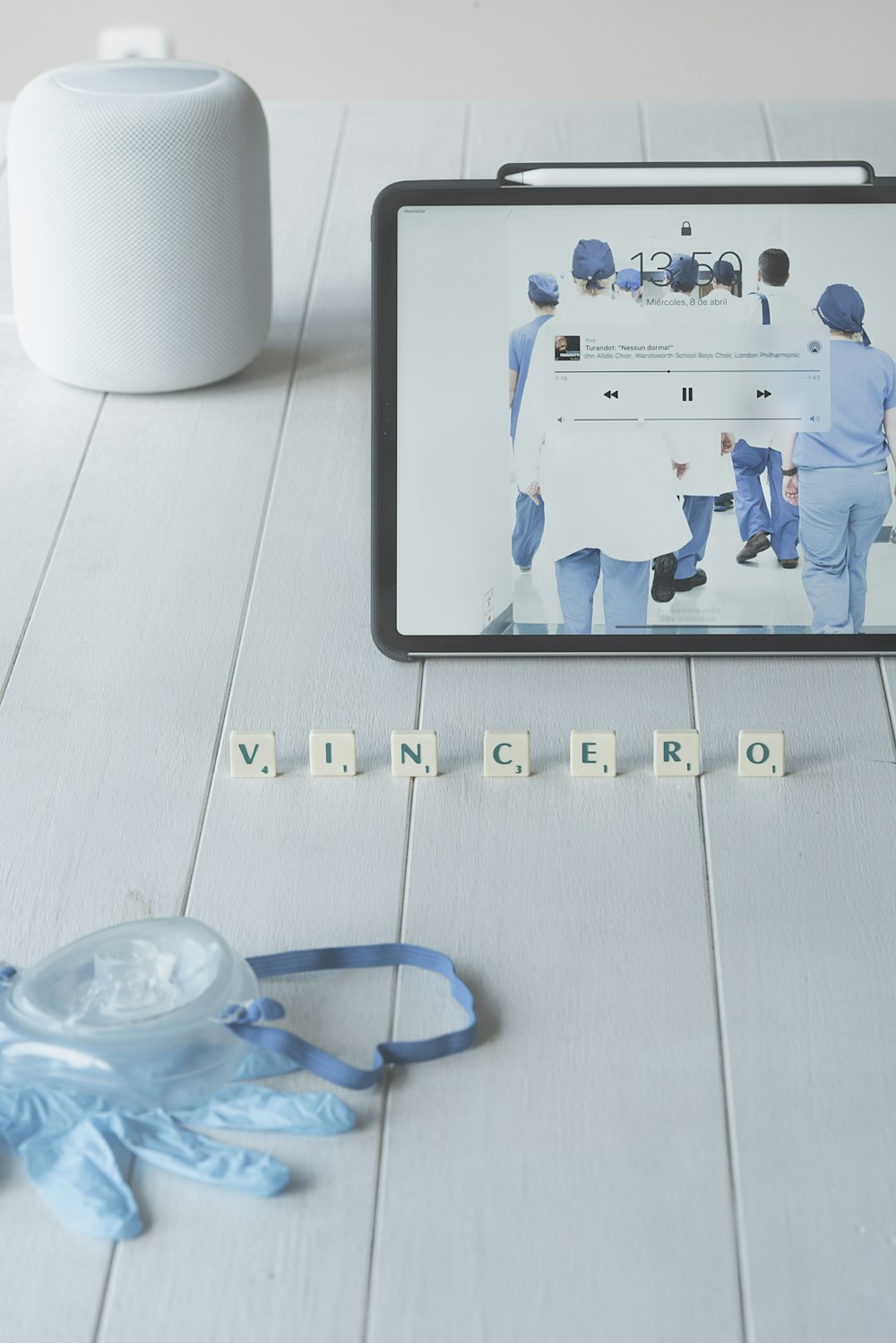 white ceramic mug beside blue and white plastic toy