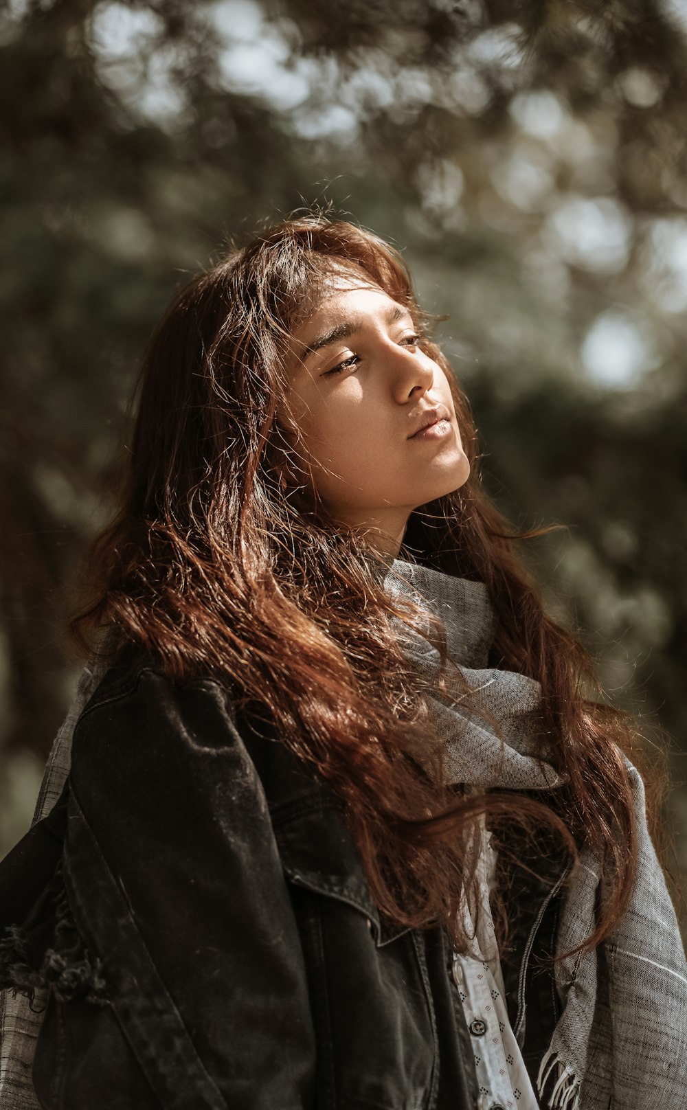 woman in black coat with grey scarf