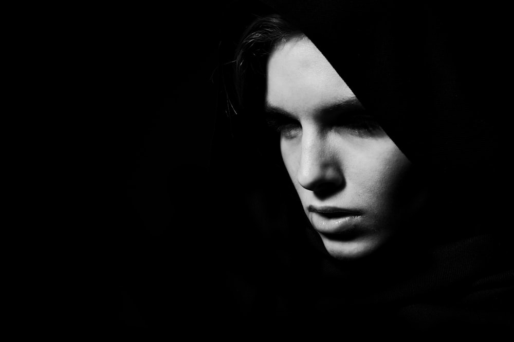 womans face in grayscale photography