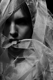 woman in white veil in grayscale