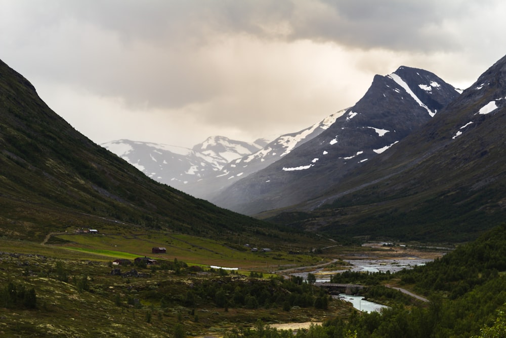 green mountains under white clouds during daytime