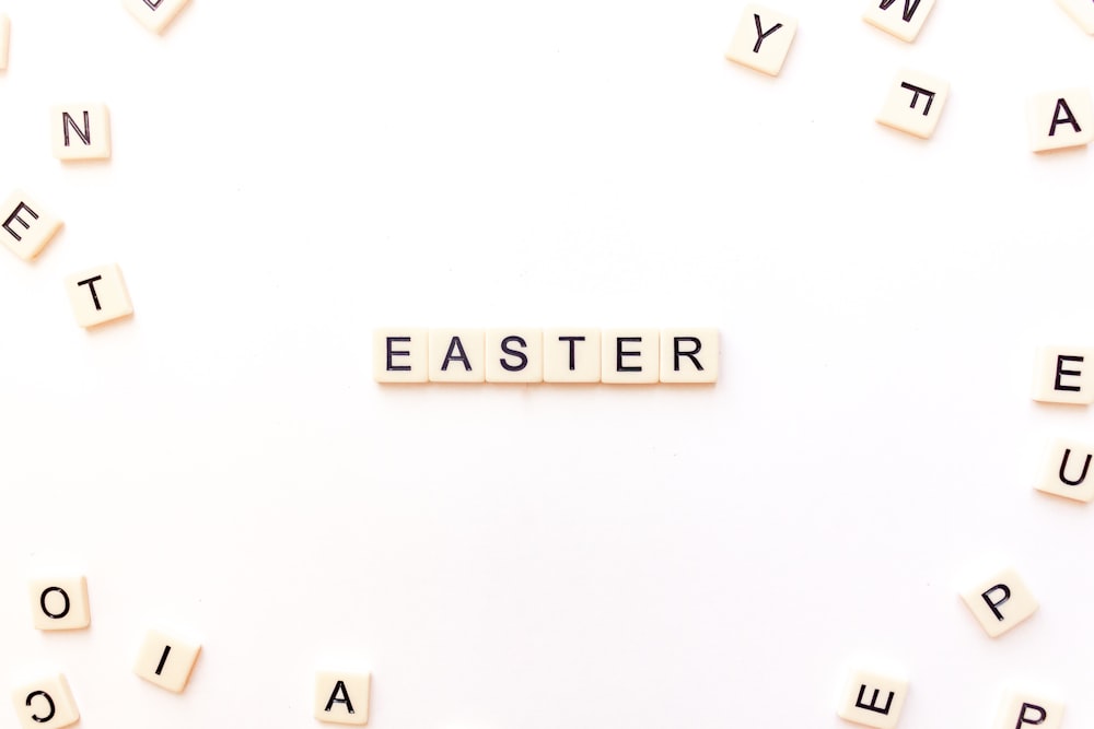 the word easter spelled with scrabbles on a white background