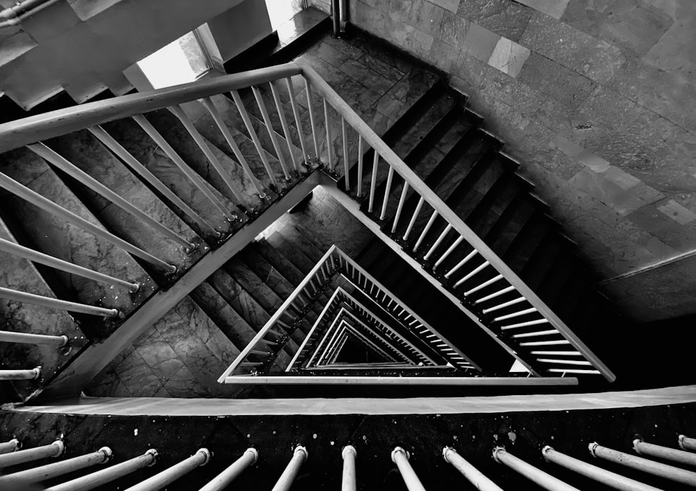 grayscale photo of spiral staircase