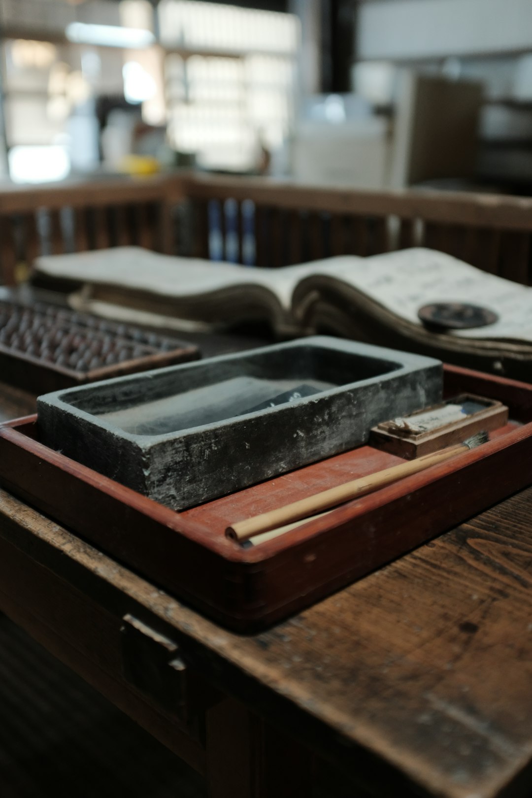 black and brown book on brown wooden table