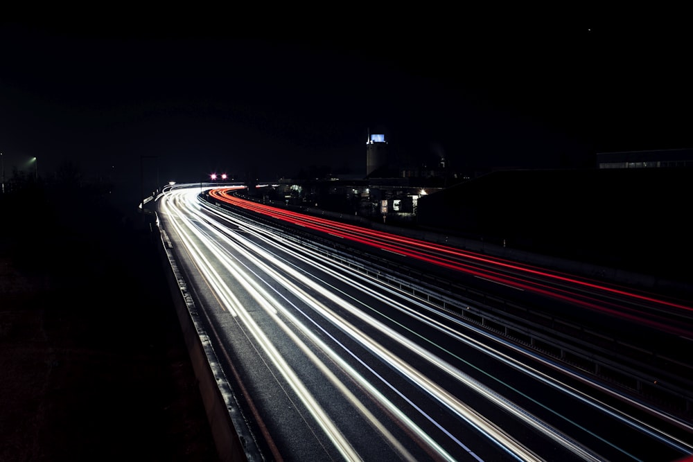 time lapse photography of cars on road during night time