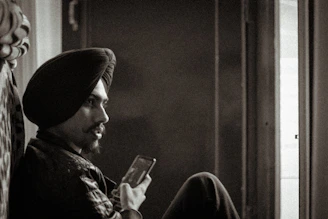 A candid photo of Mayur Hatwar thoughtfully reviewing product roadmaps with AI-themed digital overlays.