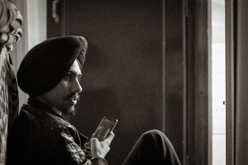 A candid photo of Anoop Suri working thoughtfully at his desk.