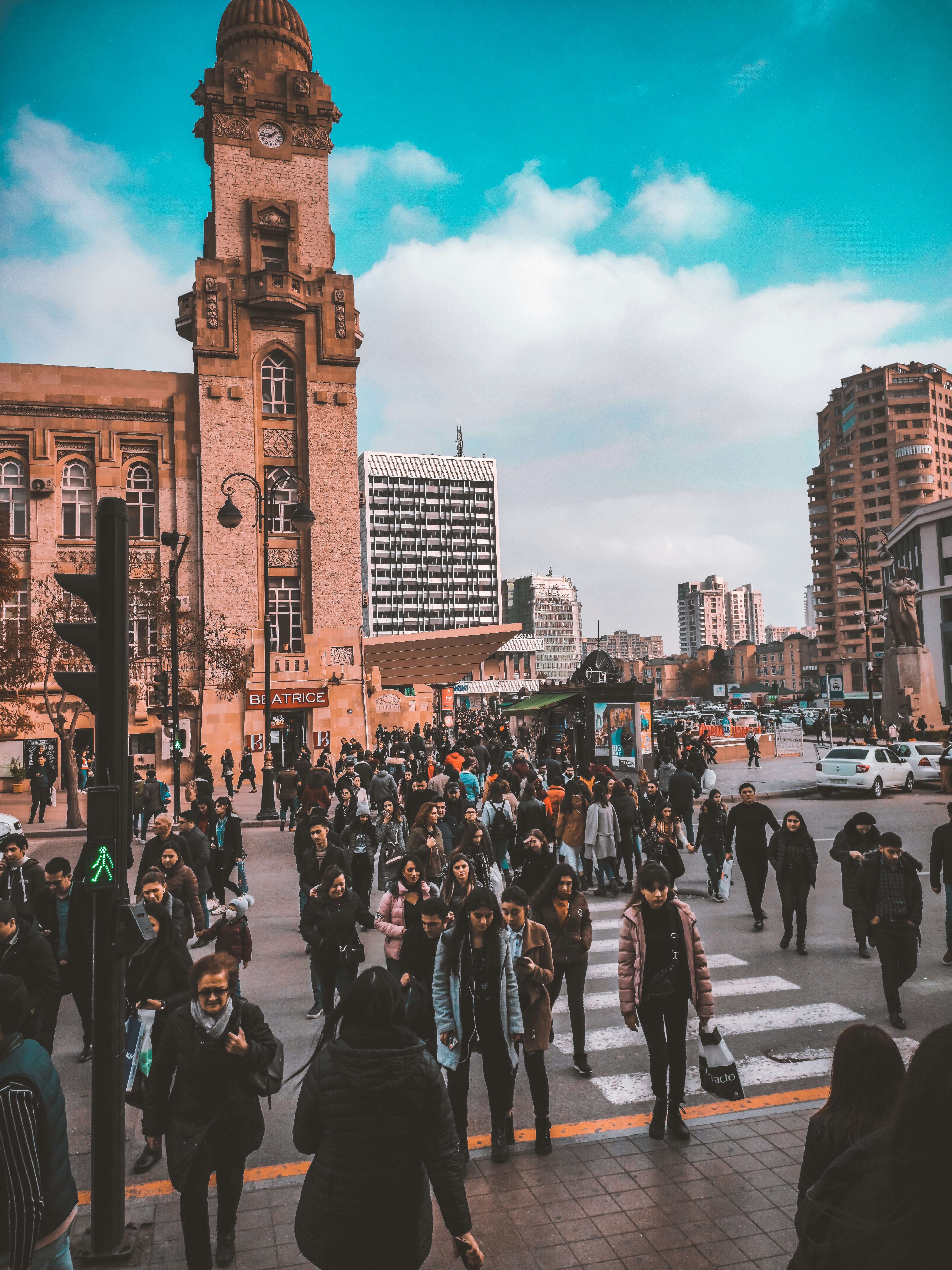 people walking on street near brown concrete building during daytime