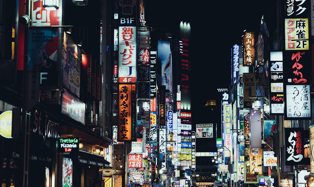 people walking on street during night time