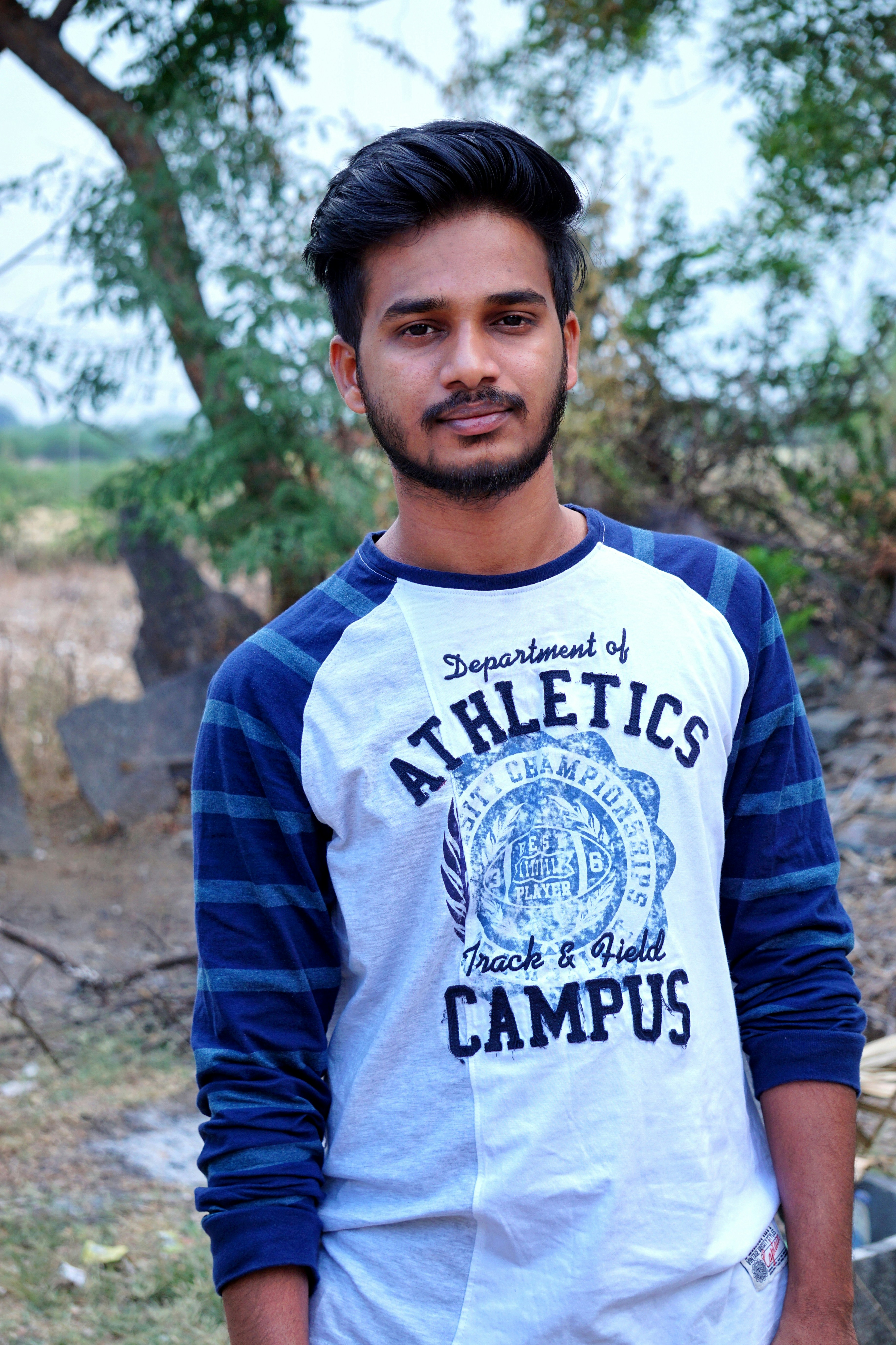 man in blue and white long sleeve shirt
