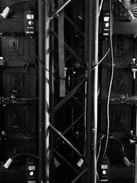 grayscale photo of metal fence