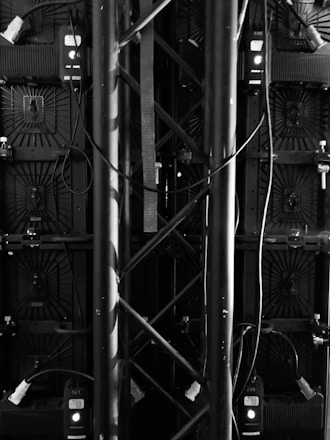 grayscale photo of metal fence