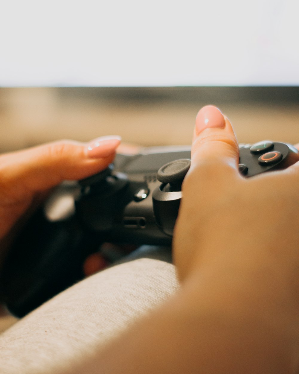 person holding black game controller