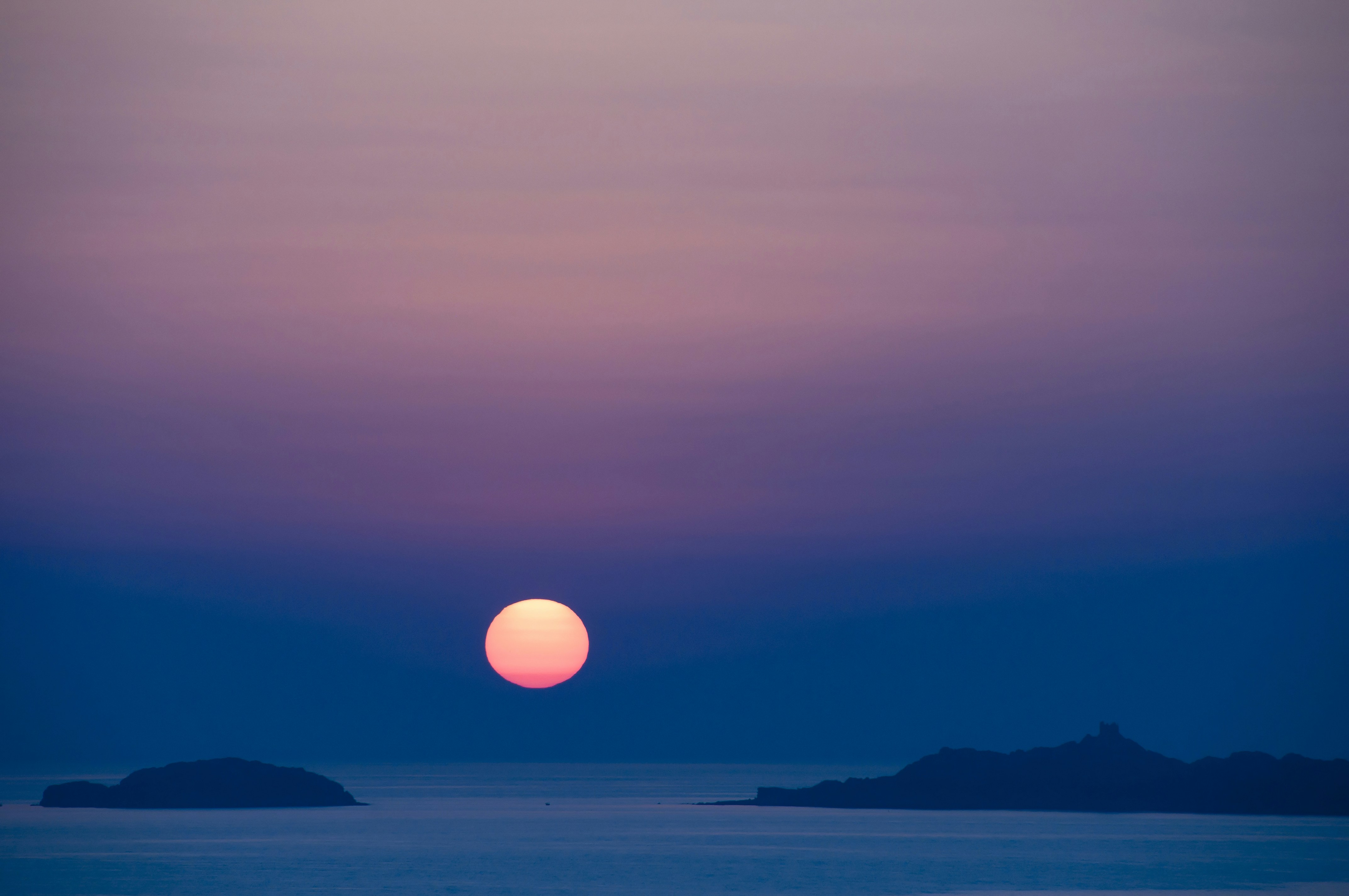 body of water during sunset