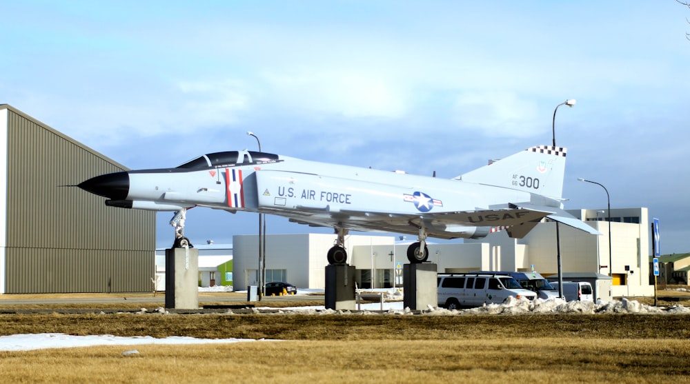 white and gray airplane on airport during daytime