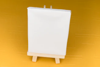 A pristine white canvas stretched on a wooden frame in natural light.