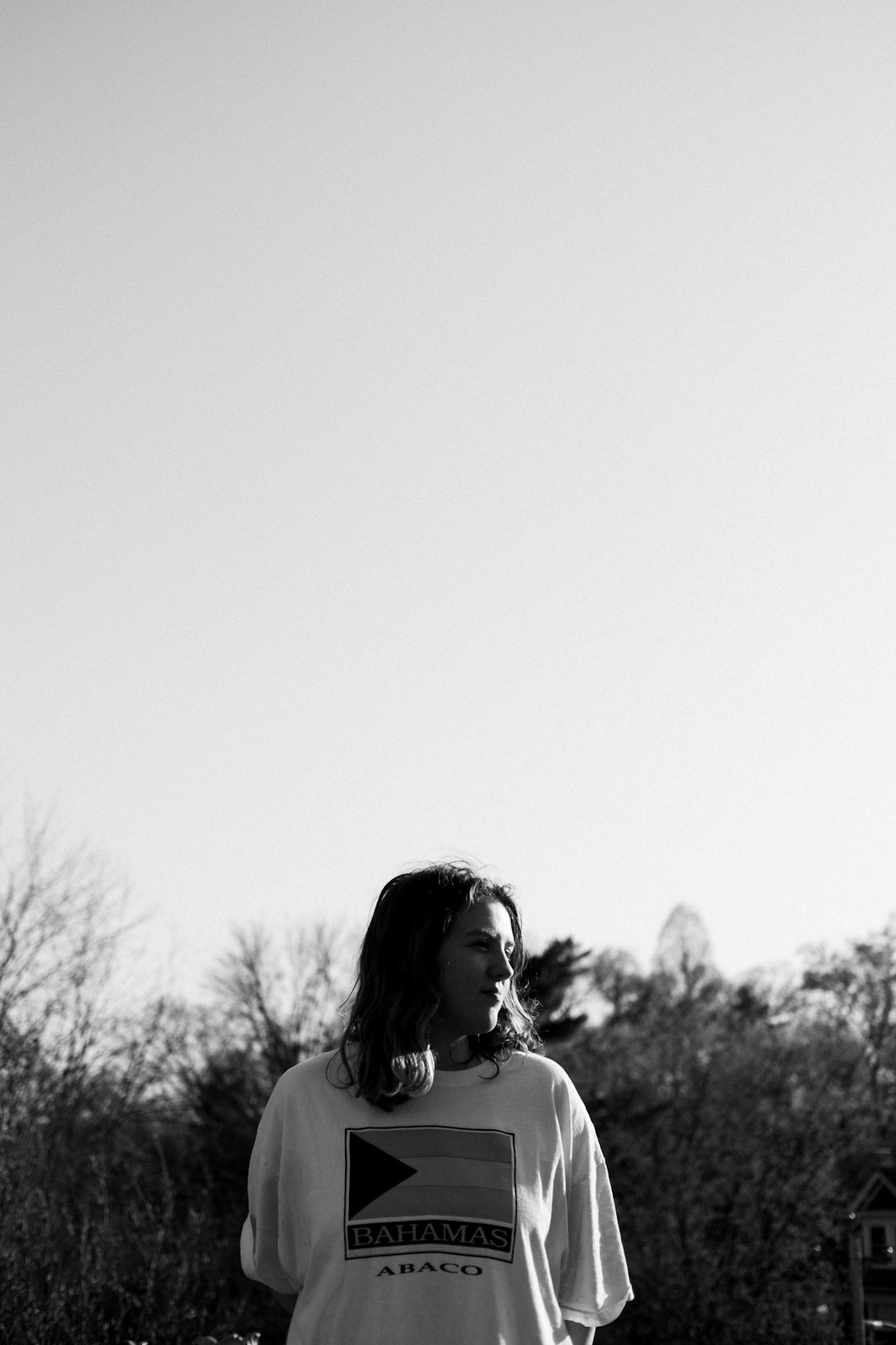 grayscale photo of woman in tank top