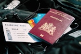 a passport and a boarding pass are on a bag
