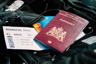 a passport and a boarding pass are on a bag