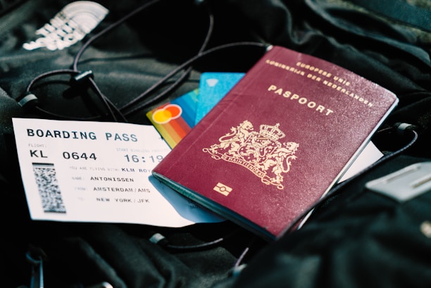 a passport and a boarding pass are on a bag