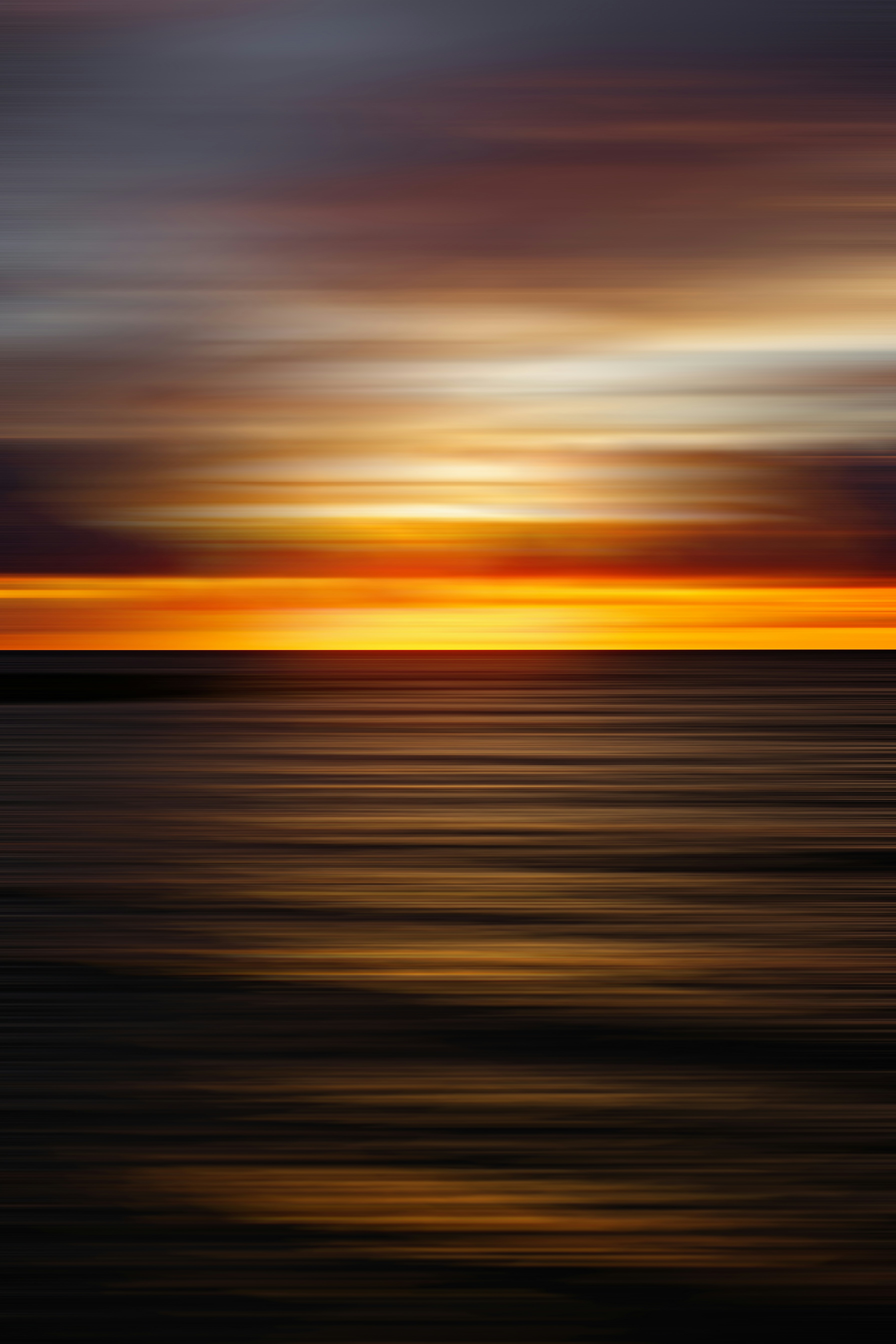 body of water during sunset