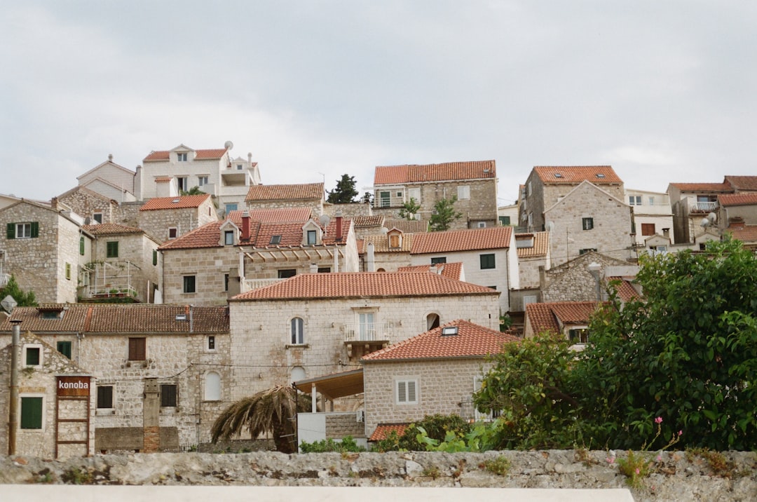 brown and white concrete houses during daytime