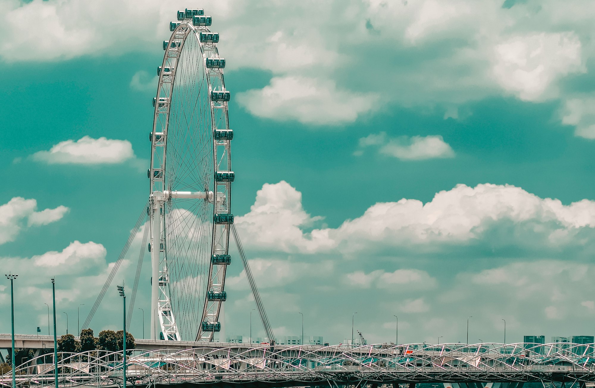 white and gray bridge under cloudy sky during daytime